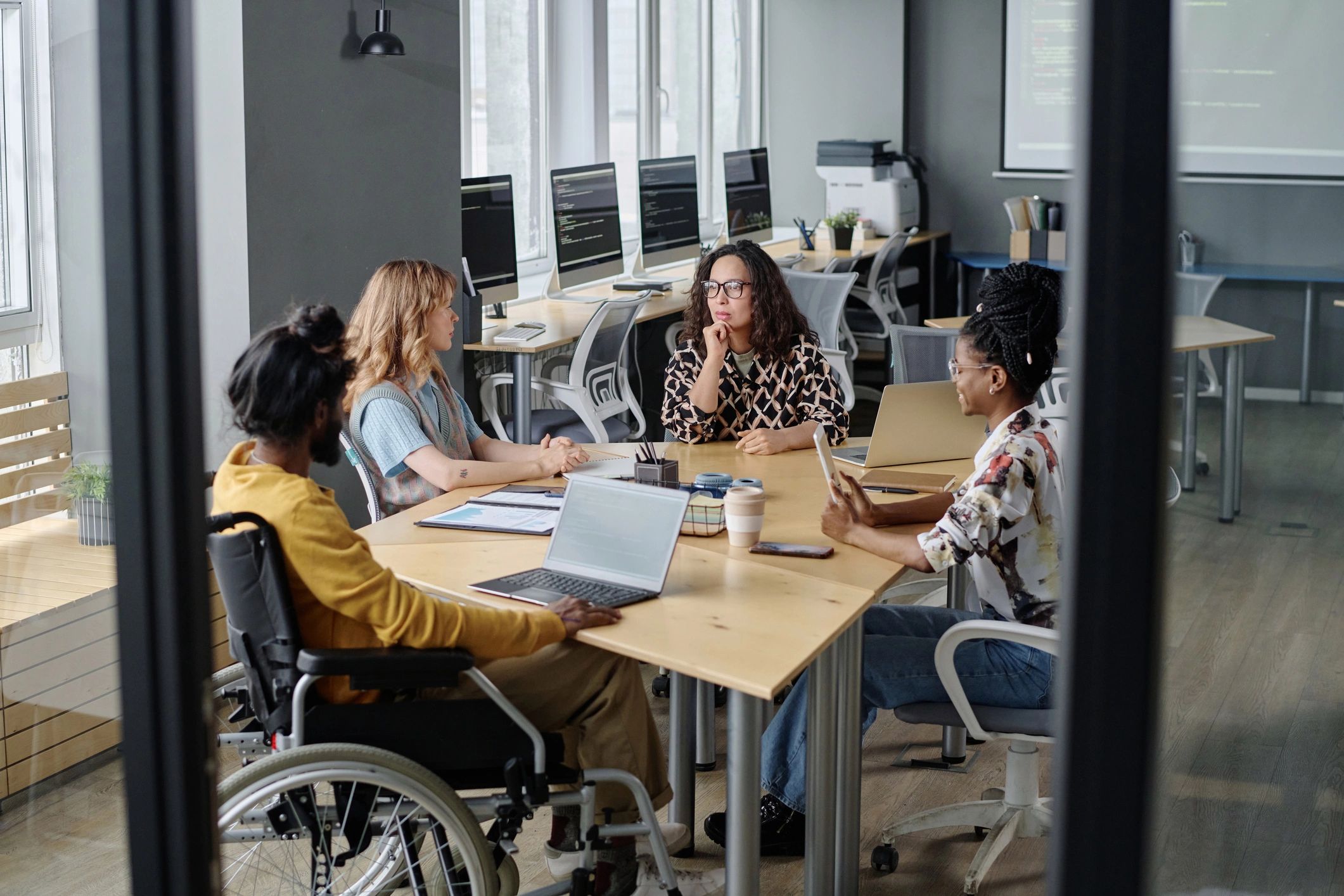 Consulting team discussing payroll operations and workforce administration